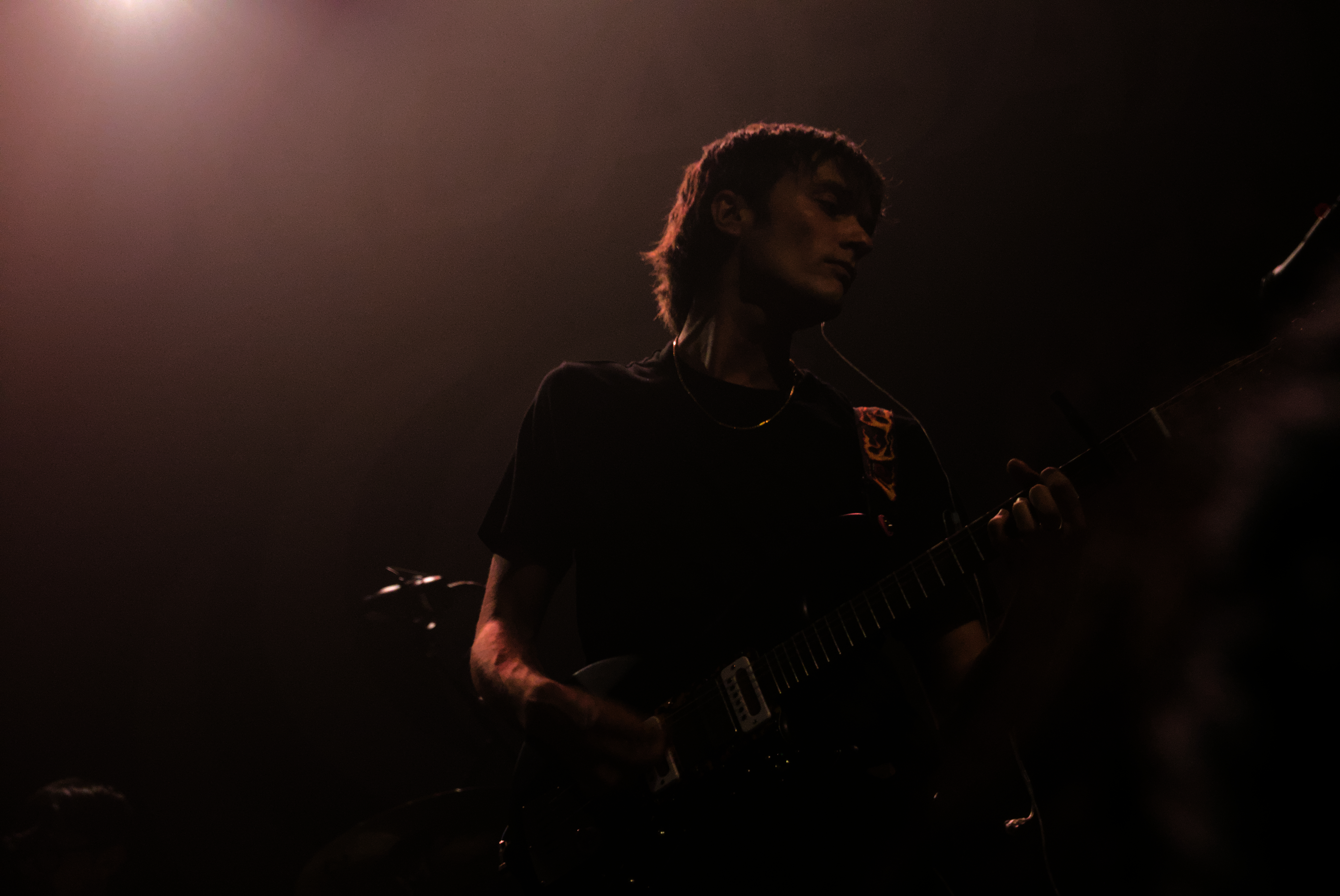 Vundabar's Brandon playing guitar in blue light