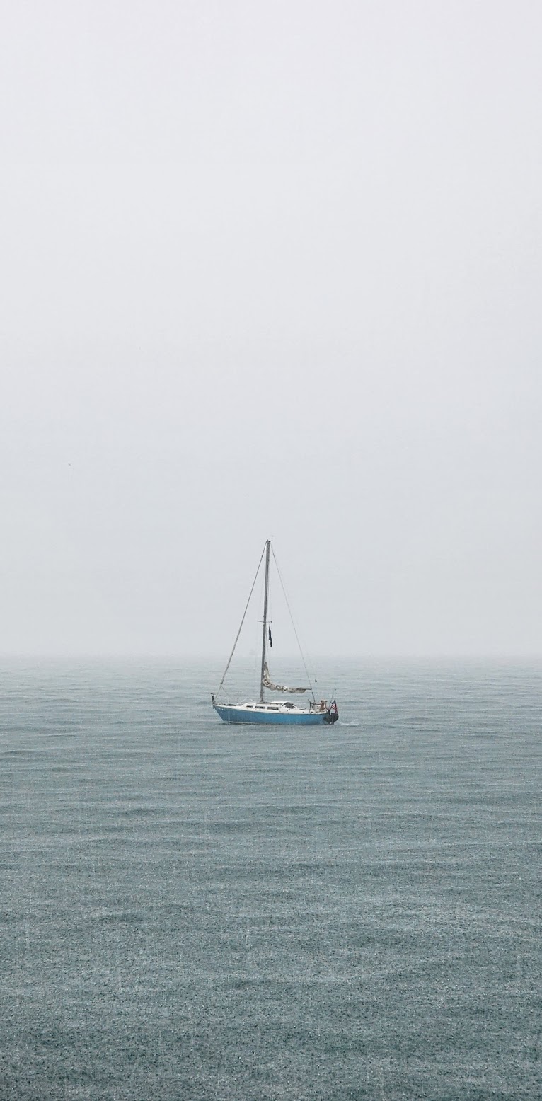 Sailboat in the pouring rain at Montrose Moonrise Vista Point