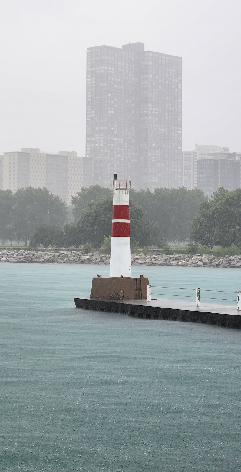 Lighthouse in the pouring rain at Montrose Moonrise Vista Point