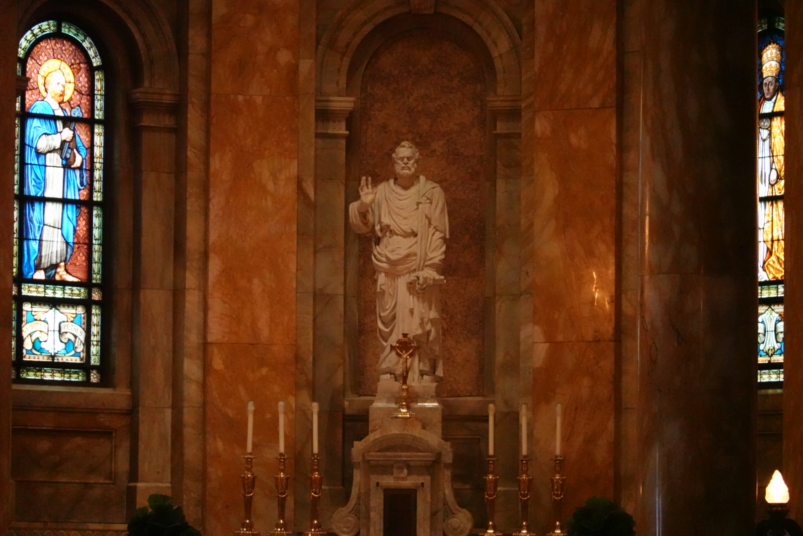 Statue in St Agnes Church in St Paul, surrounded by candles