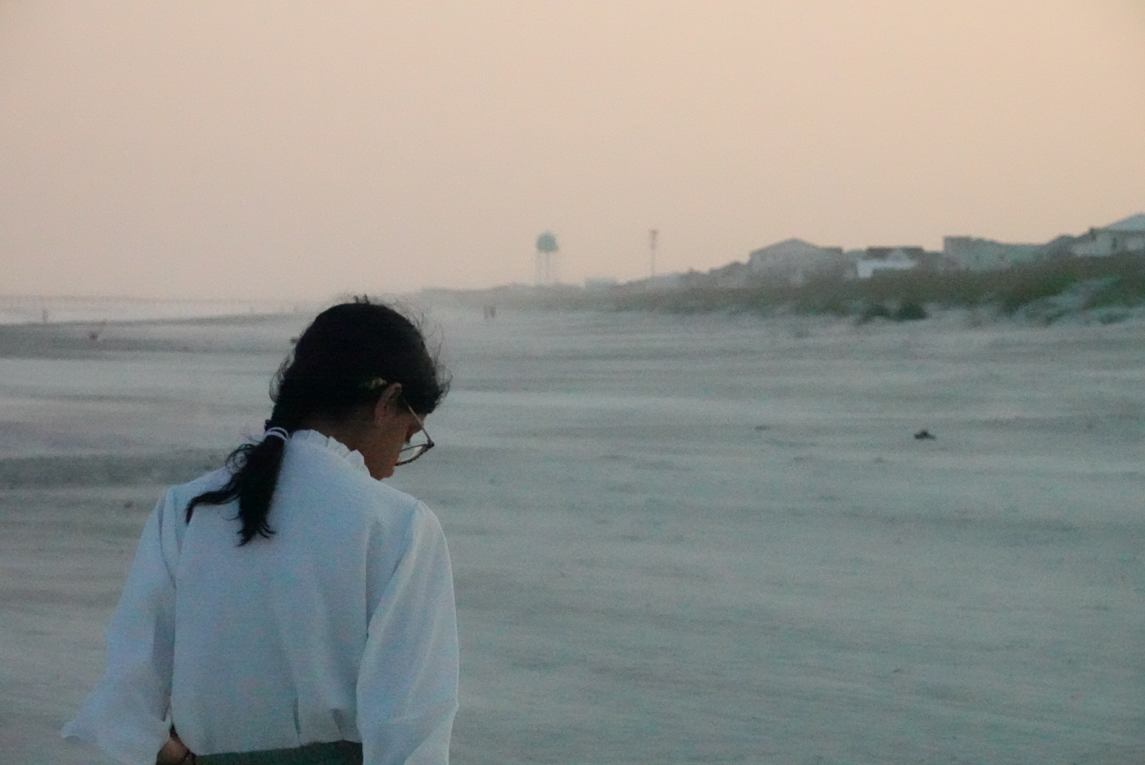 Shot of girl walking in the sand